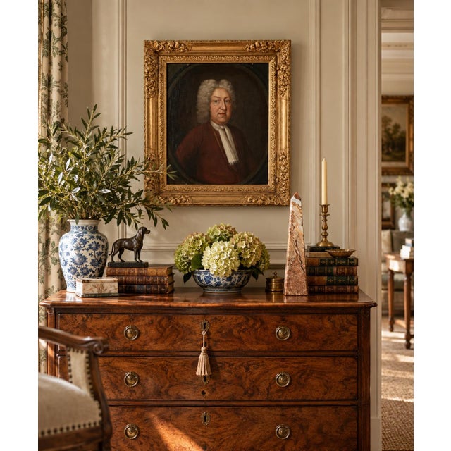 An evocative late 18th-century British School portrait of a gentleman, rendered in oil on canvas and presented within a...