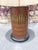A wonderfully distinctive table lamp crafted from an antique German coffee roaster advertising tin, featuring original...