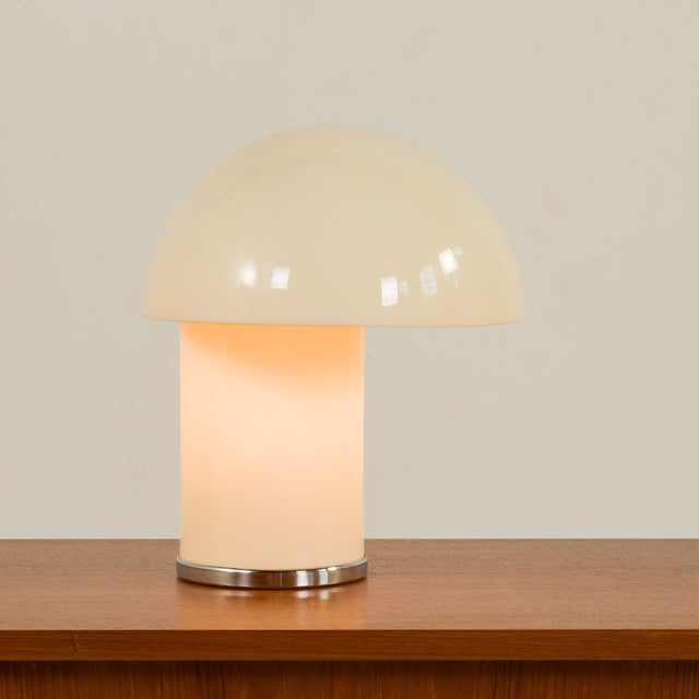 This Italian table lamp was designed by Verner Panton and Marcello Siard and manufactured by Collezioni Longato in Padova...