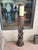 Here us a rustic farmhouse carved hard wood barley twist floor candle stand. A 4" wide candle will fit inside a 4.5" top....