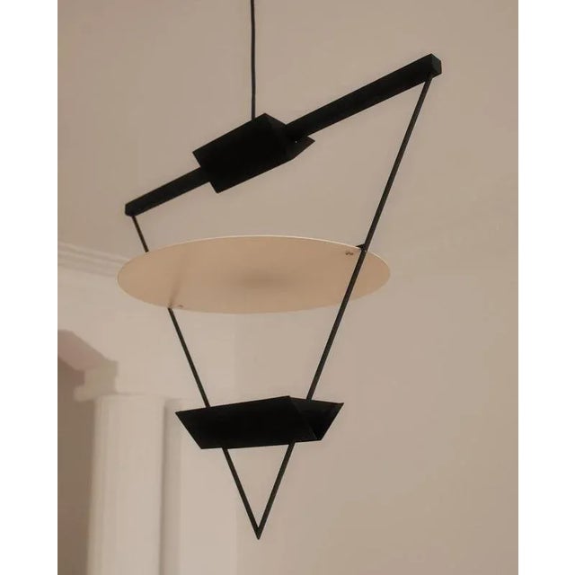 Striking architectural halogen suspension lamp from the 1980s, designed by swiss architect mario botta (b. 1943). This...