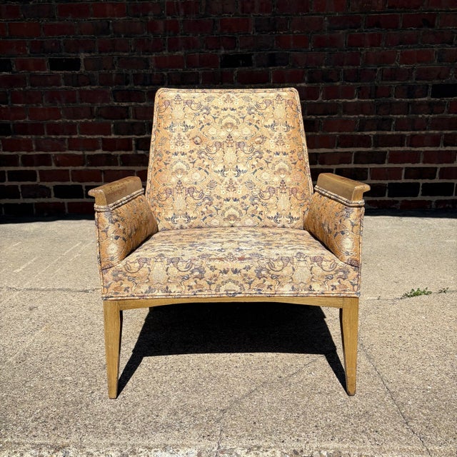 Mid Century Modern Tommi Parzinger Arm Lounge Chair. This chair have a very unique design that we believe is a Tommi...