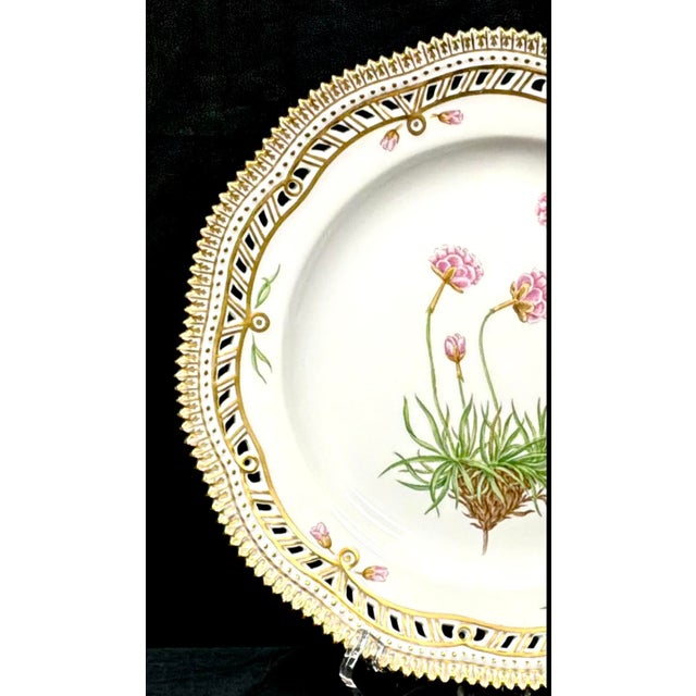 Royal Copenhagen Flora Danica Porcelain Plate, Armeria sibirica Turcz, with Pierced Gilt Border. Each plate in this...