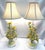 Gorgeous Italian tole table lamps from the mid 20th century. The hand painted metal tole lamps have painted yellow flowers...
