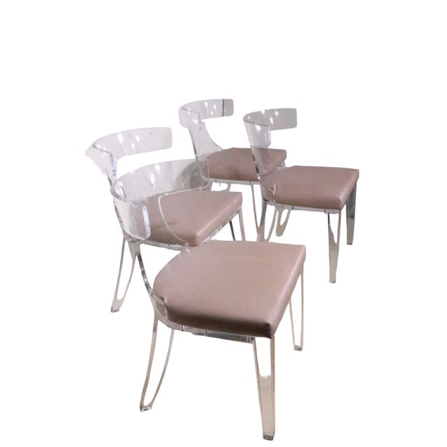 Voguish set of four lucite dining chairs by Safavieh Couture, in very good, original, clean and ready to use condition....