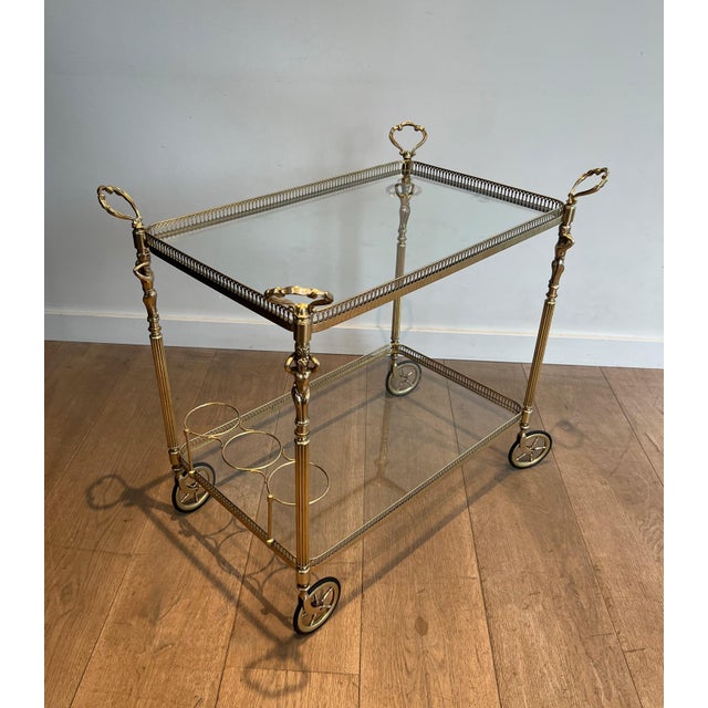 This very beautiful, elegant, and rare neoclassical-style drinks trolley is made of brass with cherubs. It is a French...