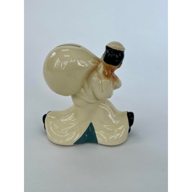 Great retro ceramic sailor savings bank, these were given out by the banks as gifts. Will look great on a bookshelf!