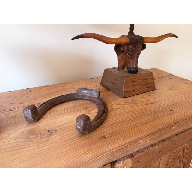 Primitive equestrian vibes abound with this large antique horseshoe, attributed to a draft horse circa 1900s. This piece...
