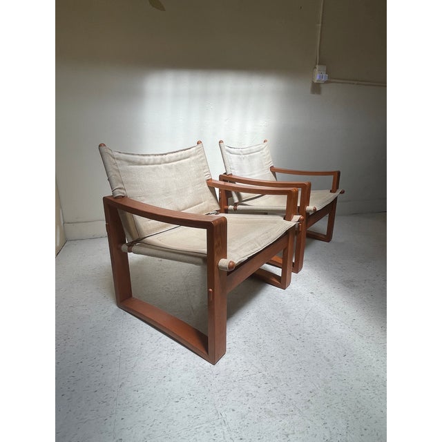 This is a pair of Safari Chairs, originally designed by Borge Jensen for Bernstorffsminde Møbelfabrik Denmark circa 1960....