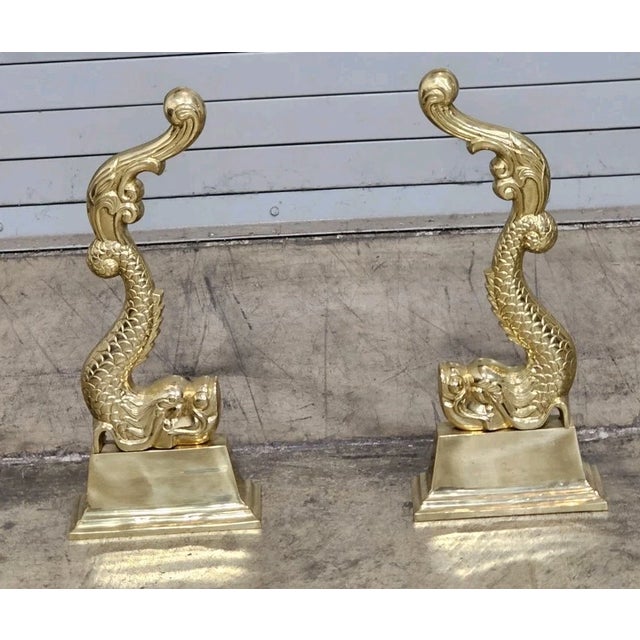 Store Item: Cast Metal Gold Brass Tone Andiron Dolphin Koi Fire Dogs Description: Cast Brass replicated 18th Century...