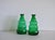 A set of green glass vases or decanters designed by Edvin Ollers and produced by Limmareds Glasbruk, Sweden, c. 1940s....