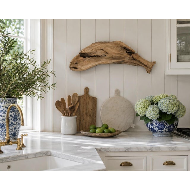 A distinctive folk-art serving tray hand carved from a naturally irregular piece of driftwood in the form of a whale. The...