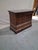 Elegant French Restoration period commode crafted in richly figured walnut and topped with a substantial gray marble slab...