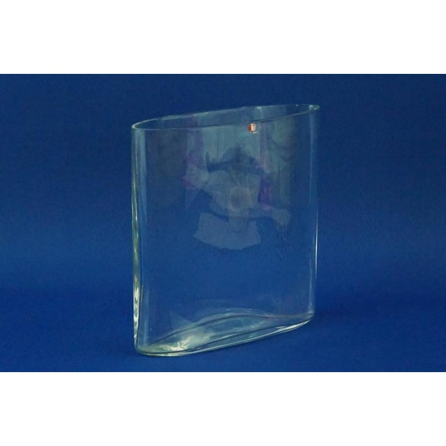 Item description: A stunning transparent glass vase, entirely handmade and signed under the base by artist Tapio Wirkalla,...
