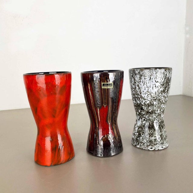 These original vintage vases was produced in the 1970s in Germany. It is made of ceramic pottery in fat lava optic. Super...