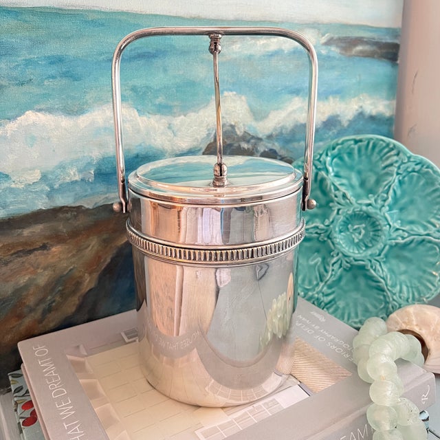 Impress your guests with the Italian Silverplate Ice Bucket by Macabo, where exquisite design meets functionality, making...