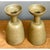 This pair of candle holders embraces a confident, geometric silhouette rooted in mid-century modernist design, each piece...