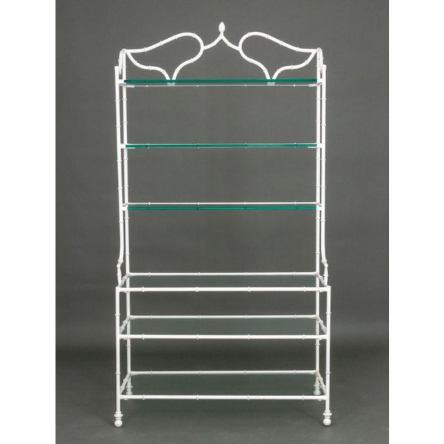 Hollywood Regency White Patinated Wrought Iron Etagere, with six glass shelves and faux bamboo motif. 86" H x 44" W x 20"...