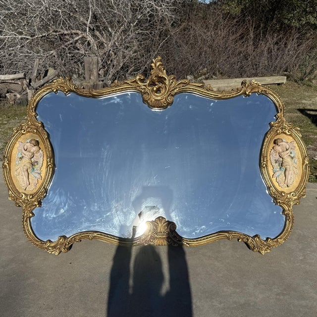 Vintage French Rococo Louis XV gilt wall mirror with bisque figural lovers. Amazing large mirror in excellent vintage...