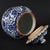 Elevate your home decor with this classic blue and white porcelain ginger jar. This elegant piece features a beautiful,...