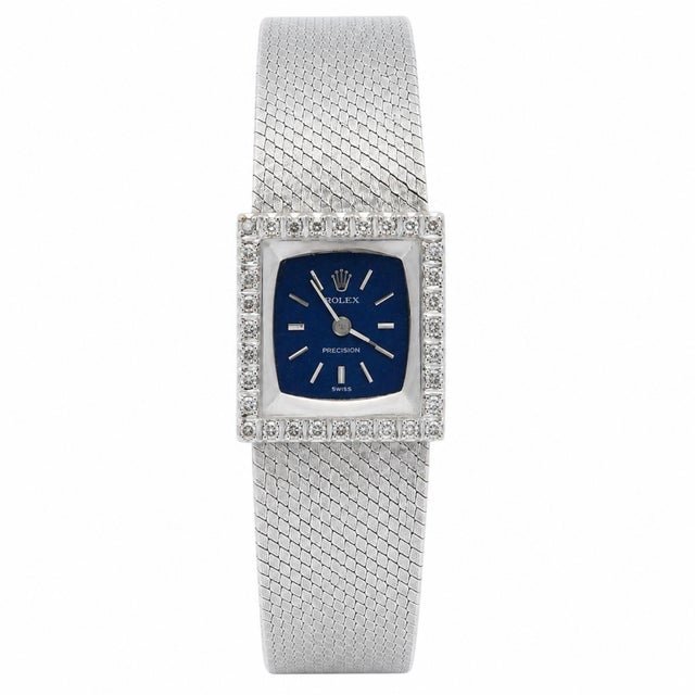Vintage Rolex Precision reference 2157 in solid 18k white gold. A square diamond-set bezel frames a deep blue dial with...