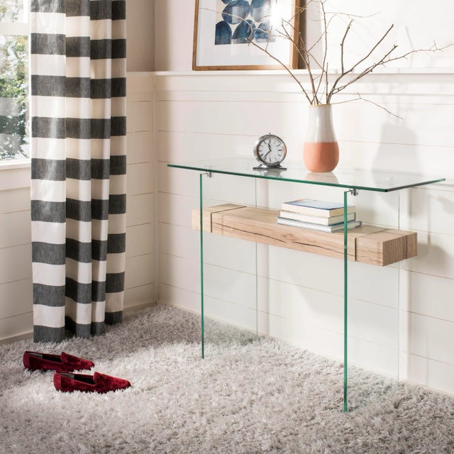 The epitome of elegance, this angular modern glass console table was inspired by treasures in London’s design museum....