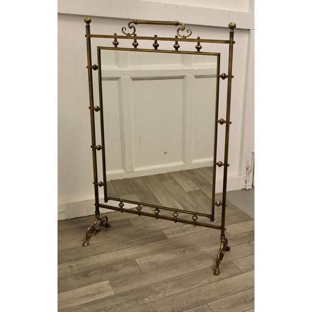 Tall Art Nouveau Brass and Mirror Fire Screen This is a very decorative Fire Screen it has an ornate brass stand, with a...