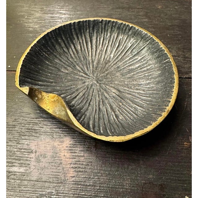 A small patinated and blackened bronze vide poche attributed to Walter Bosse or Richard Rohac, circa 1960s DIMENSIONS:...