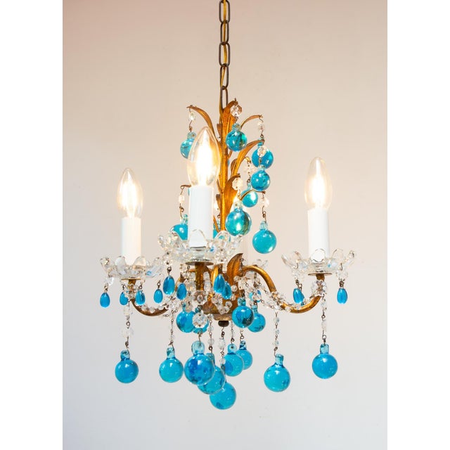 It uses 4 E14 bulbs. It measures 26 cm on each side and 33 cm diagonally. It hangs down a total of 73 cm, and the minimum...