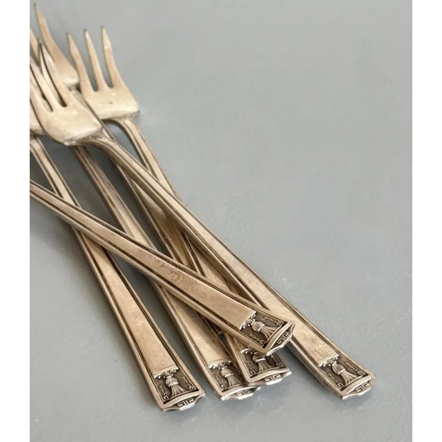 These antique appetizer or seafood forks are crafted of inlaid "super plate" in the 1923 Century pattern by Holmes &...