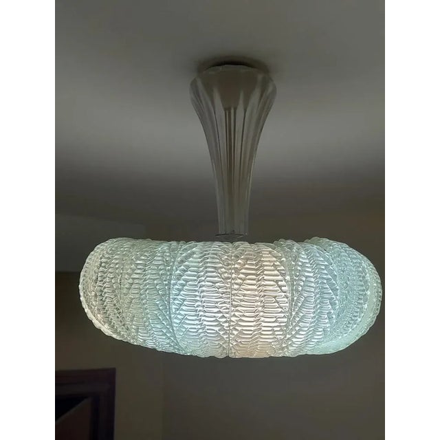 Splendid 50s chandelier, documented production by Barovier & Toso, consisting of over 20 Murano glass curved leaves, with...