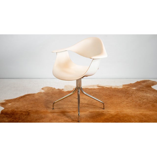 Authentic Herman Miller reissue of George Nelson's iconic 1958 Swag Leg armchair, circa 2008. Features white molded...