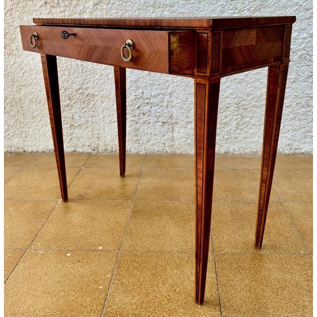 19th Spanish side table with cared Solomonic turned legs and iron stretcher. The top has a carved edges and a beautiful...