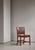 A rare 1937 example of kaare klint’s iconic red chair, executed in oak and retaining its original niger leather...