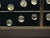 Italian black Murano glass sideboard with four drawers arranged in a two-by-two grid. The fronts display 28 circular glass...