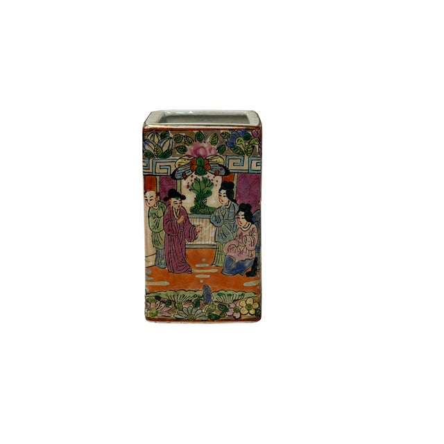 This exquisite rectangular porcelain brush pot (bitong) is finely enameled in vibrant famille rose and polychrome hues,...