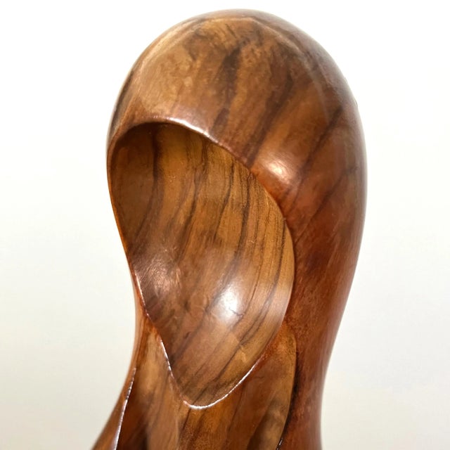 This Mid-20th Century abstract sculpture of the Madonna is hewn from burlwood and has the sculptor's signature carved into...