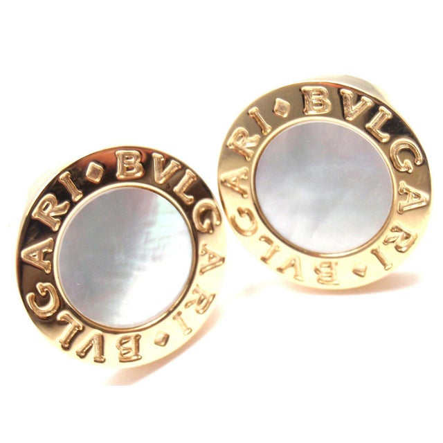 About This Piece: Metal: 18k Yellow Gold Measurements: 17mm x 18mm x 20mm Weight: 19.3 grams Stones: 2 round mother of...