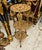A remarkable French-inspired side table featuring an intricate three-tier design completely adorned with gold leaf...