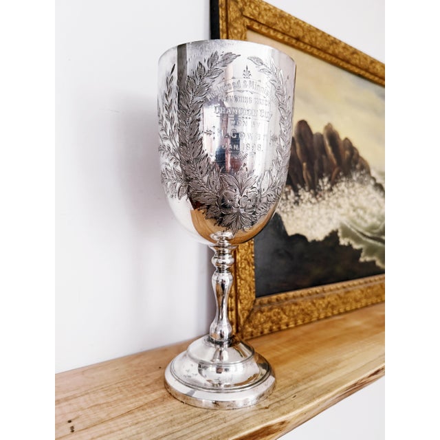 A beautiful antique English circa early 1898 silver plated trophy cup, engraved on the front to read: Moakwood &...