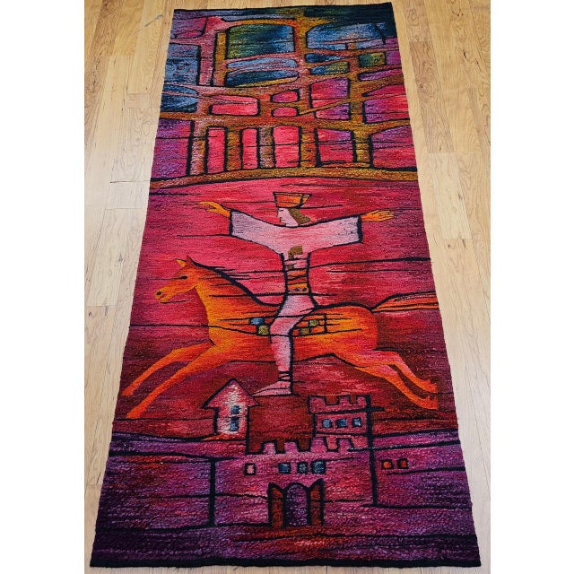 This stunning vintage mid-century tapestry depicts a folkloric rider performing acrobatics atop a galloping horse — a...