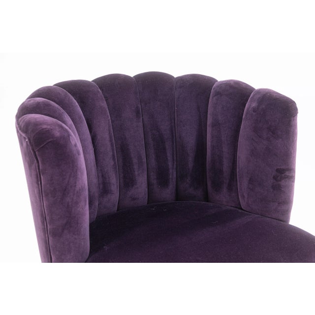 An art deco style contemporary modern channel back accent chair. This lovely lounge chair features a deep purple velvet...