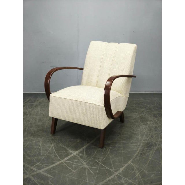 Exceptional Art Deco armchair designed by Jindřich Halabala and produced in Czechoslovakia during the 1940s. Recognized...