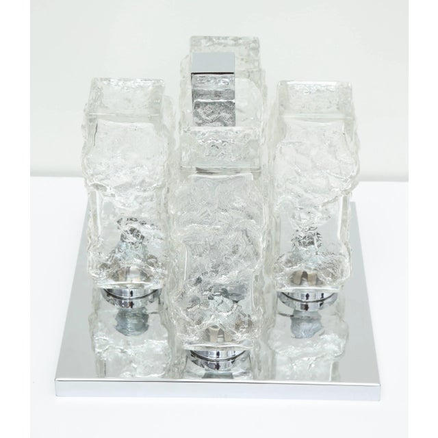 Mid-Century Modern chrome flush mount ceiling fixture by Kaiser. The chrome plate supports four Ice glass textured pieces...