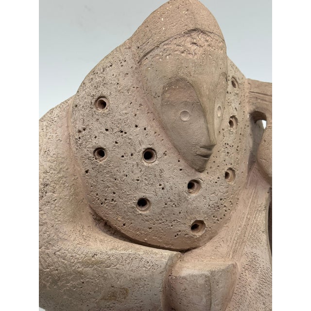 A wonderful Cubist hand built Terracotta Musician sculpture. it is monogrammed C on the lower back. It quite good...