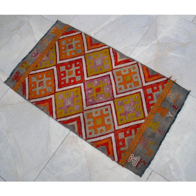 Offered is a hand-woven mini Turkish rug. Dimension: 18.7 x 32.2 inches Material : Wool on cotton. Origin: Aegean Age:...
