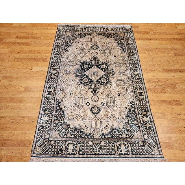 This elegant vintage Indian silk rug exemplifies the refined craftsmanship and luminous beauty of late 20th century...