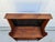 A primitive pine bookcase with two shelves and painted black panels to the rear. Each shelf has 10 inches of depth. This...