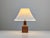 This table lamp reflects the Danish Modern design language of the 1960s, built from solid teak and molded acrylic. The...