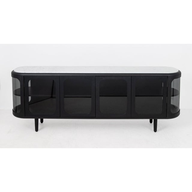 Matteo Zorzenoni (Italian, b. 1978) "Settebello" Black Sideboard, with a white Carrara marble top above ebonized wood base...